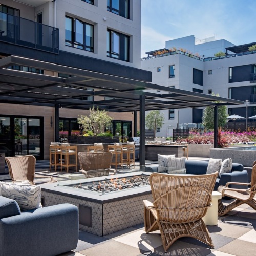 Luxury Apartments for Rent in Santa Clara, CA - Sofia - Courtyard with a Gas Firepit, Chairs, Couches, a Water Fountain, Potted Plants, Maintained Landscaping, and BBQ Grills. Luxury Apartments for Rent in Santa Clara, CA - Sofia - Courtyard with a Gas Firepit, Chairs, Couches, a Water Fountain, Potted Plants, Maintained Landscaping, and BBQ Grills.